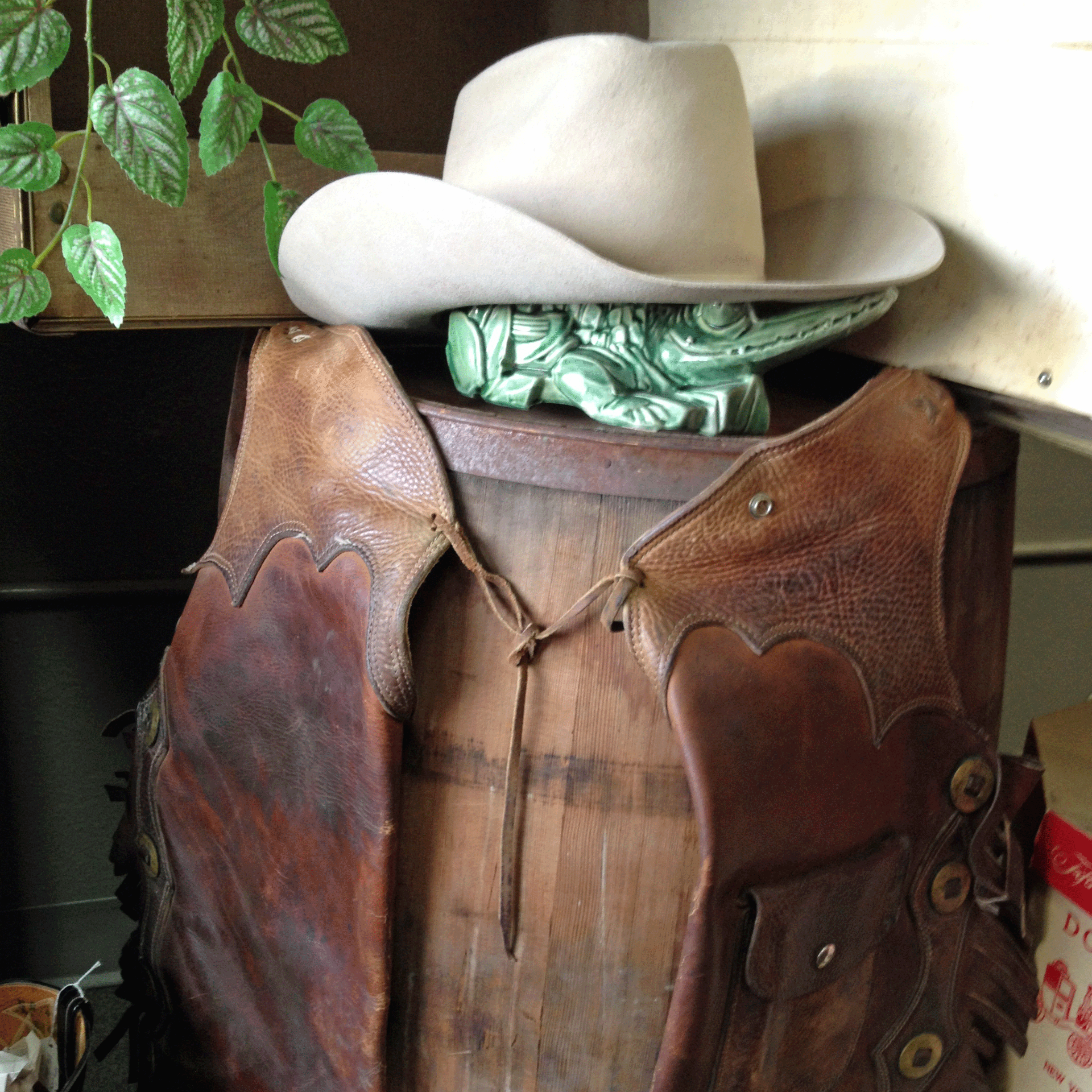 Cowboys can slip into western glamping style with this leather vest and hat.